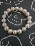 Pearls for the Pup Who Loves to Shine.”
